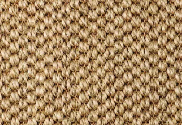 Close-up of a woven beige and brown textured fabric, showing tightly interlaced yarns forming a consistent pattern.