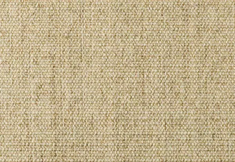 Close-up view of beige textured fabric with a woven pattern.