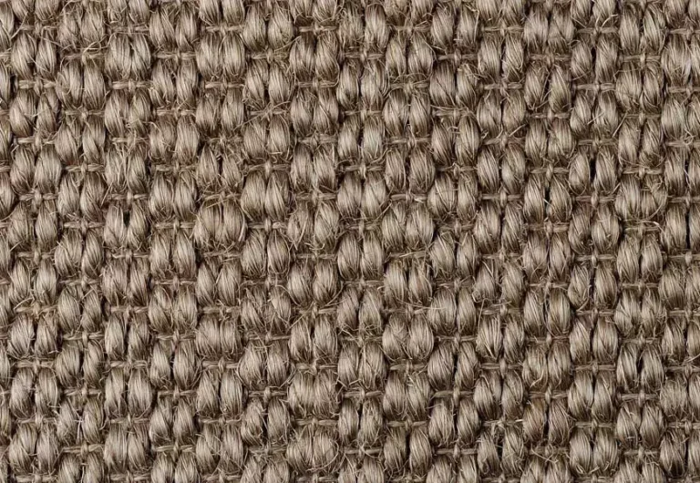 Close-up of a brown, tightly woven fabric with a textured pattern.