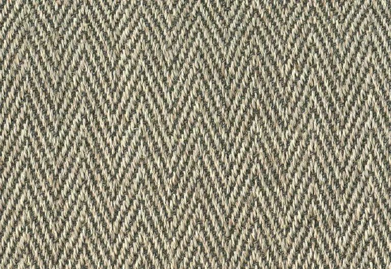 Close-up of a fabric with a herringbone pattern in shades of brown and beige.