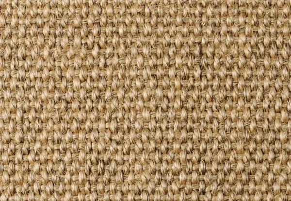 A close-up view of woven beige fabric, showcasing a textured pattern of interlaced fibers.