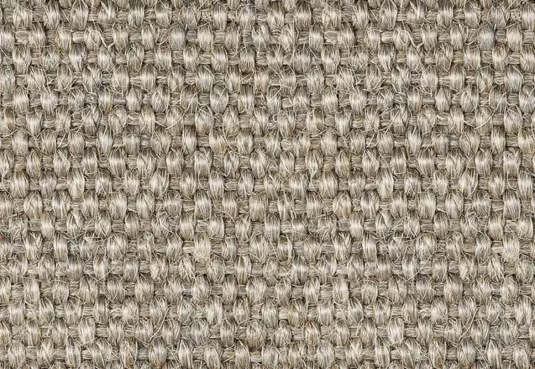 Close-up of a beige, woven fabric with a textured, crosshatched pattern, showing detailed stitching and fiber interlacing.