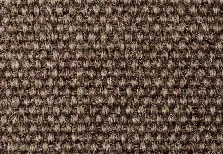 Close-up view of a brown, textured woven fabric with a coarse, interlaced pattern.