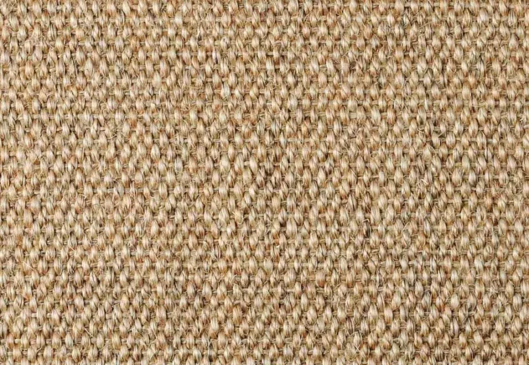 Close-up of a textured surface with a woven pattern made of natural fibers in shades of brown and beige.