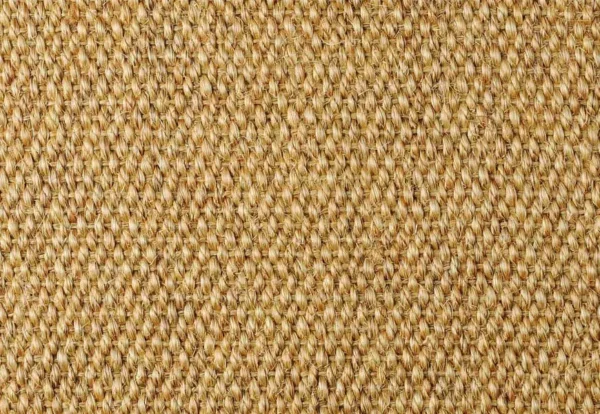 Close-up of a woven texture with a pattern of interlaced natural fibers, featuring a beige and brown color palette. The surface has a rough, rustic appearance.