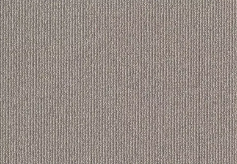 Close-up of a texture featuring vertical thin lines in a beige color, resembling a woven fabric or textured wallpaper. The pattern is consistent and evenly spaced across the entire surface.