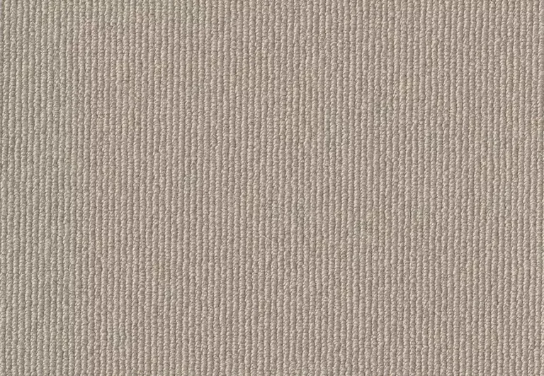 Close-up of a beige textured fabric with vertical ribbing. The material appears soft and uniform in color and texture.