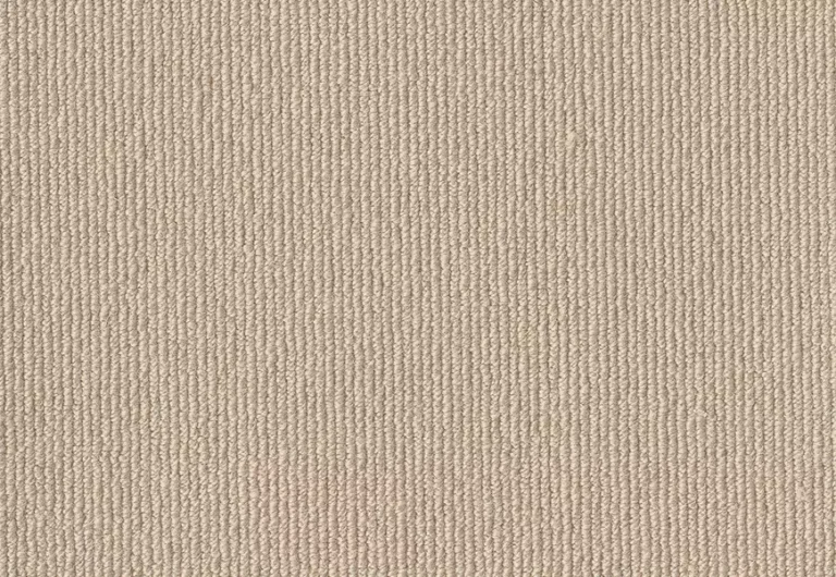 A close-up view of a beige, textured fabric with fine, vertical ribbing.