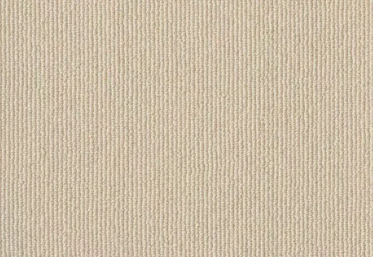 Close-up of a beige corduroy fabric showcasing its vertical ridged texture.