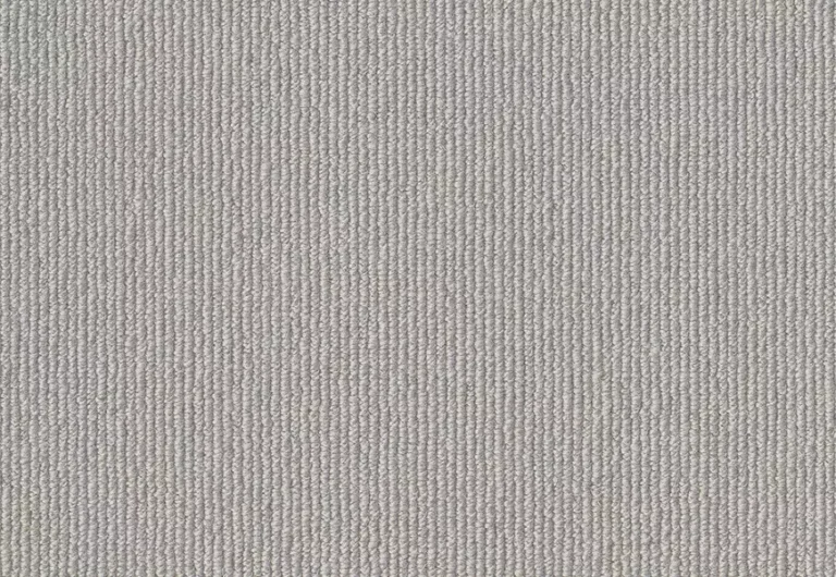 A close-up view of a textured gray fabric with a fine, tightly woven pattern.