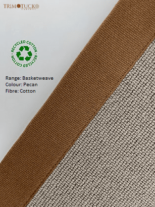 Close-up of a fabric swatch with a beige woven texture and a brown edge. Includes text: 