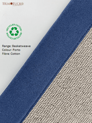 Close-up of a fabric label displaying information on a basketweave pattern. The Porto-colored fiber is cotton, with a blue strip and a green recycled cotton logo. 