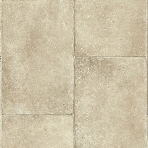 A close-up view of beige stone tiles arranged in a rectangular pattern. The tiles have a slightly textured surface with subtle variations in color.