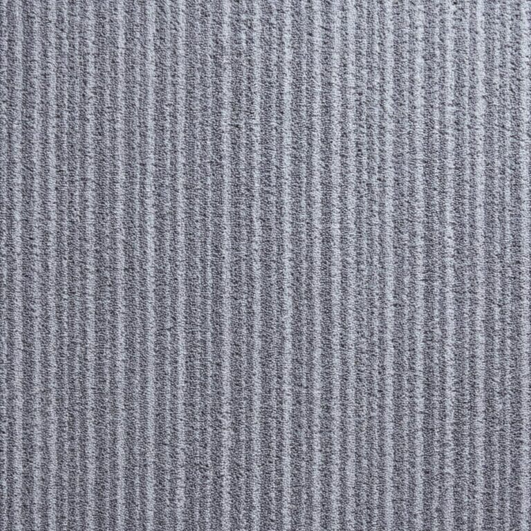 Close-up view of a textured gray surface with vertical ribbed lines.