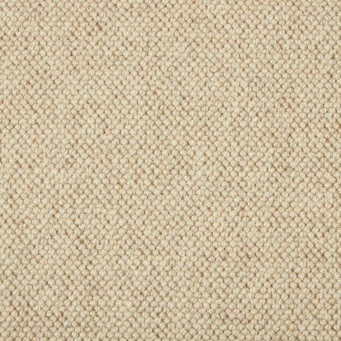 A close-up view of beige woven fabric with a textured pattern.