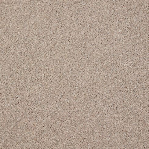 A close-up of a textured surface with a beige sand-like appearance.