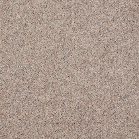 Close-up of a textured surface with a beige and grey speckled pattern, resembling a concrete wall or floor.