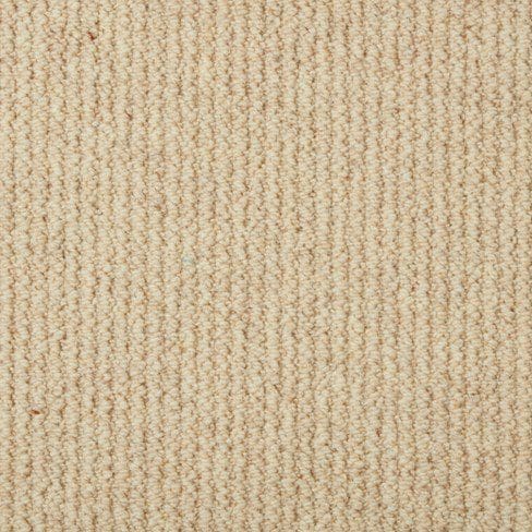 A close-up view of a beige, textured carpet with a loop pile pattern. The fibers are uniformly arranged, creating a dense and even surface.