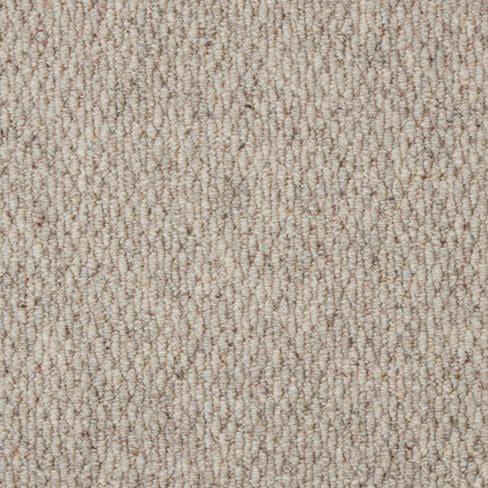 Close-up of a beige carpet with a textured, looped pile design.