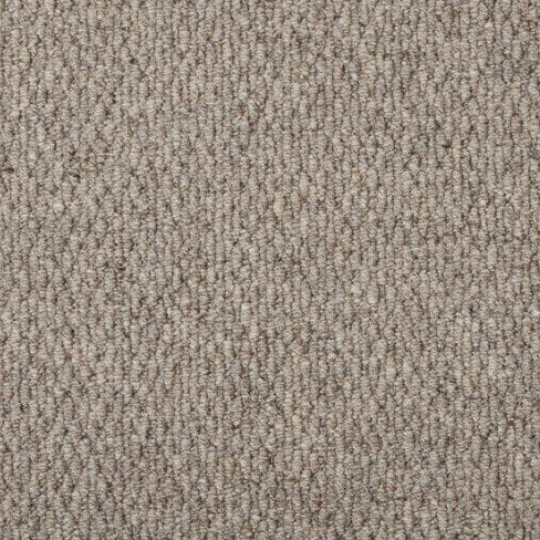 Close-up view of a beige textured carpet with a loop pile construction.