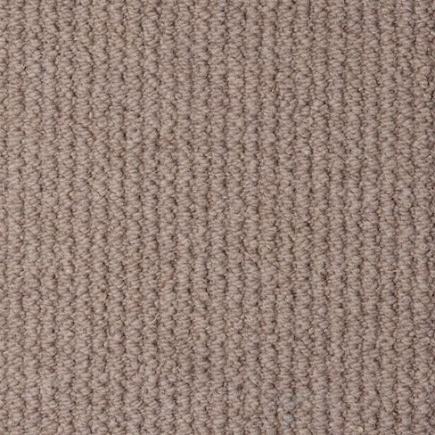 Close-up of a textured beige carpet with vertical ridges.