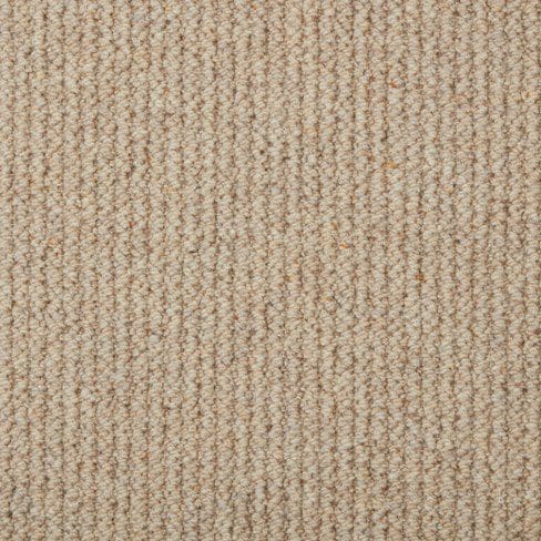 Close-up image of beige textured fabric with vertical ribbed lines.