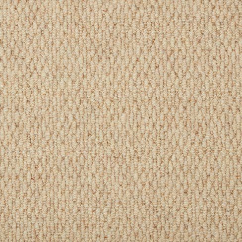 Close-up of a beige, textured carpet with a looped pile pattern.