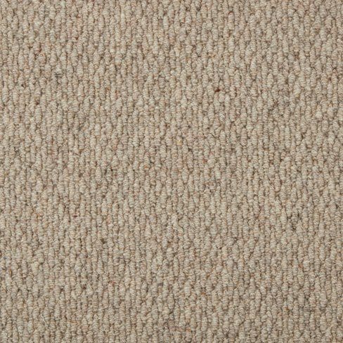 Close-up of beige textured carpet with a looped pile pattern.