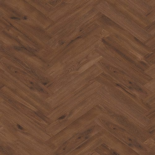A wooden floor with a herringbone pattern, featuring medium brown planks with subtle natural grain and knot details.