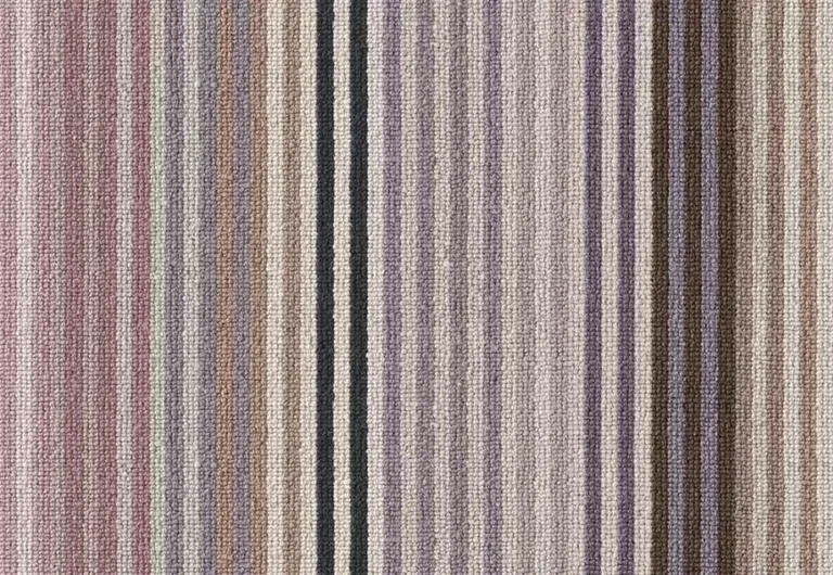 A close-up of a textured fabric with vertical stripes in shades of purple, brown, beige, and black, titled Margo Sleby Stripe Rock.