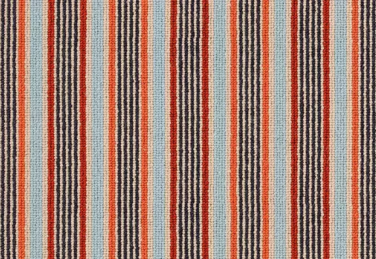 A textile featuring vertical stripes in varying widths and colors, including red, orange, navy blue, and light grey.