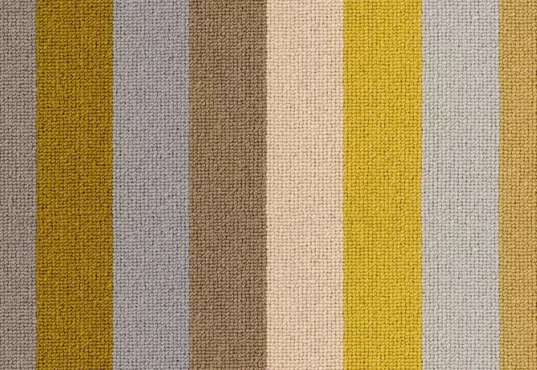 A textured fabric with vertical stripes in muted tones of gray, brown, beige, yellow, and green.