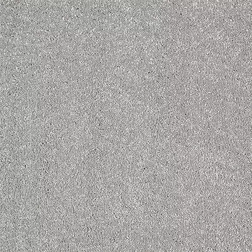 A close-up view of a gray textured surface, resembling concrete or sandpaper.