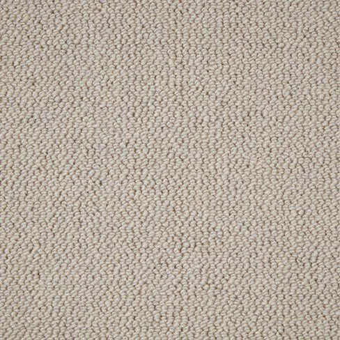 A close-up view of a beige textured carpet with a looped pile pattern. The fabric appears tightly woven.