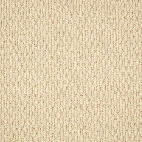 Close-up of a beige textured carpet with a loop pile design. The fibers are tightly woven, creating a uniform and durable surface.
