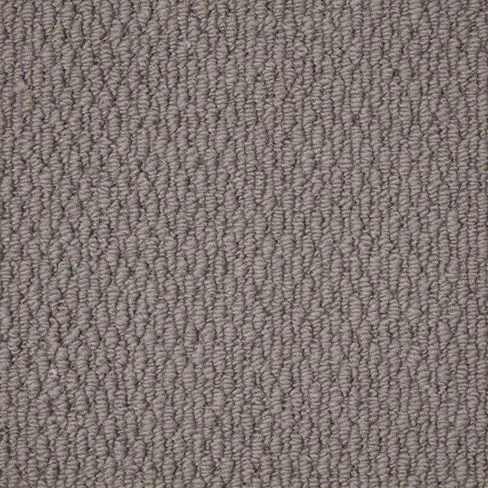 Close-up of a textured, gray, woven carpet with a tight looped pile pattern.