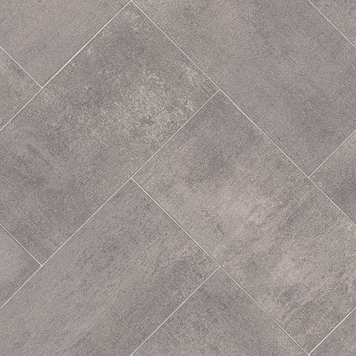 A close-up view of Versatility II Vinyl Flooring arranged in a herringbone pattern.