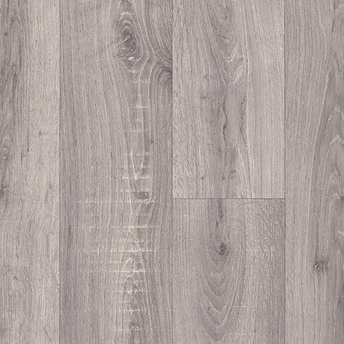 A close-up of gray wooden floorboards with visible grain and knot patterns.