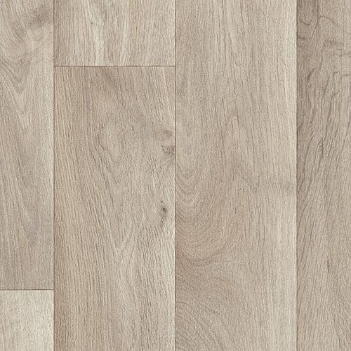 Close-up view of light-colored wooden floorboards with a subtle grain pattern.