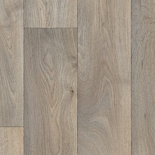 Close-up of light gray wooden floorboards arranged in a horizontal pattern, showing natural wood grain and texture.