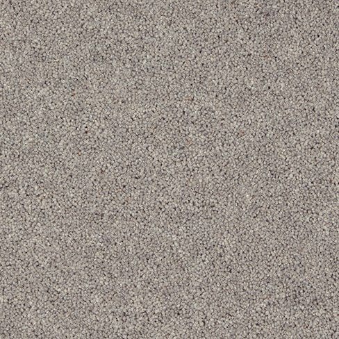 Close-up image of a grey, textured carpet with a tight weave pattern.