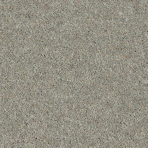 A close-up view of pebble-textured, grey-colored concrete or stone surface.