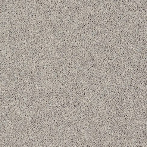 Close-up view of a beige carpet with a textured surface.