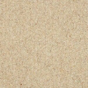 Close-up of a tan-colored, textured fabric with a tight, uniform weave pattern.