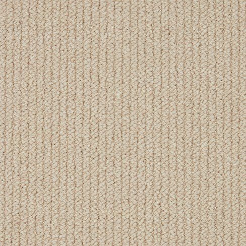 Close-up of a beige textured fabric with a woven pattern.