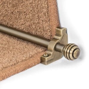 Stair Rods - Vision Sphere attached to a carpeted stair riser, secured by a decorative bracket.