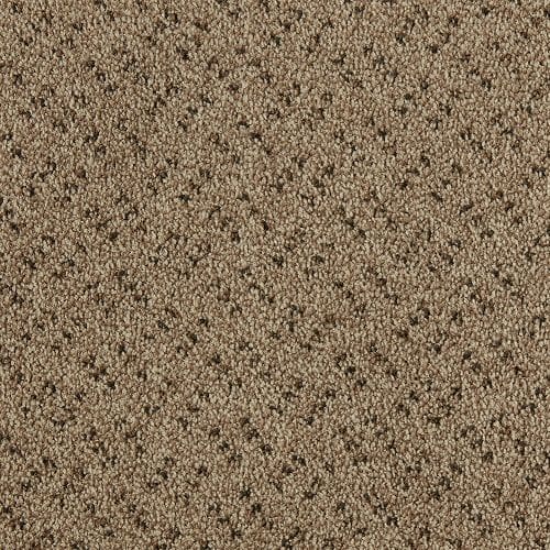 Close-up of a brown textured carpet with a subtle pattern of small, evenly spaced dots.
