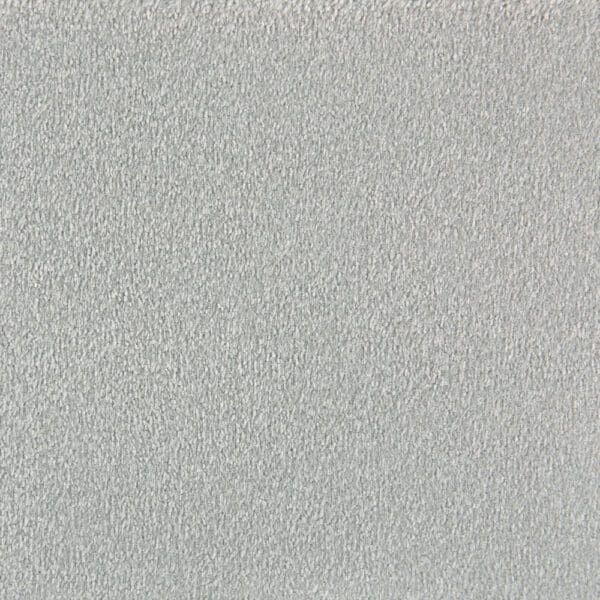 A close-up view of a light grey textured surface, resembling fabric from the Debonair Silken Velvet Collection Westex or carpet, featuring nylon stain retardant properties.