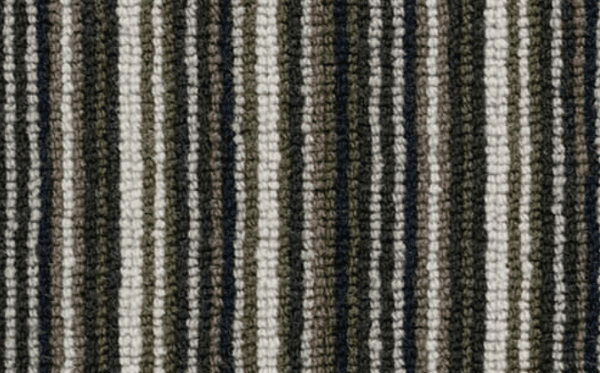 Close-up of a striped fabric pattern with alternating vertical lines in shades of black, gray, white, and green. The texture appears coarse and tightly woven, reminiscent of the Deco Collection Candy Stripe Loop & Plain Loops.