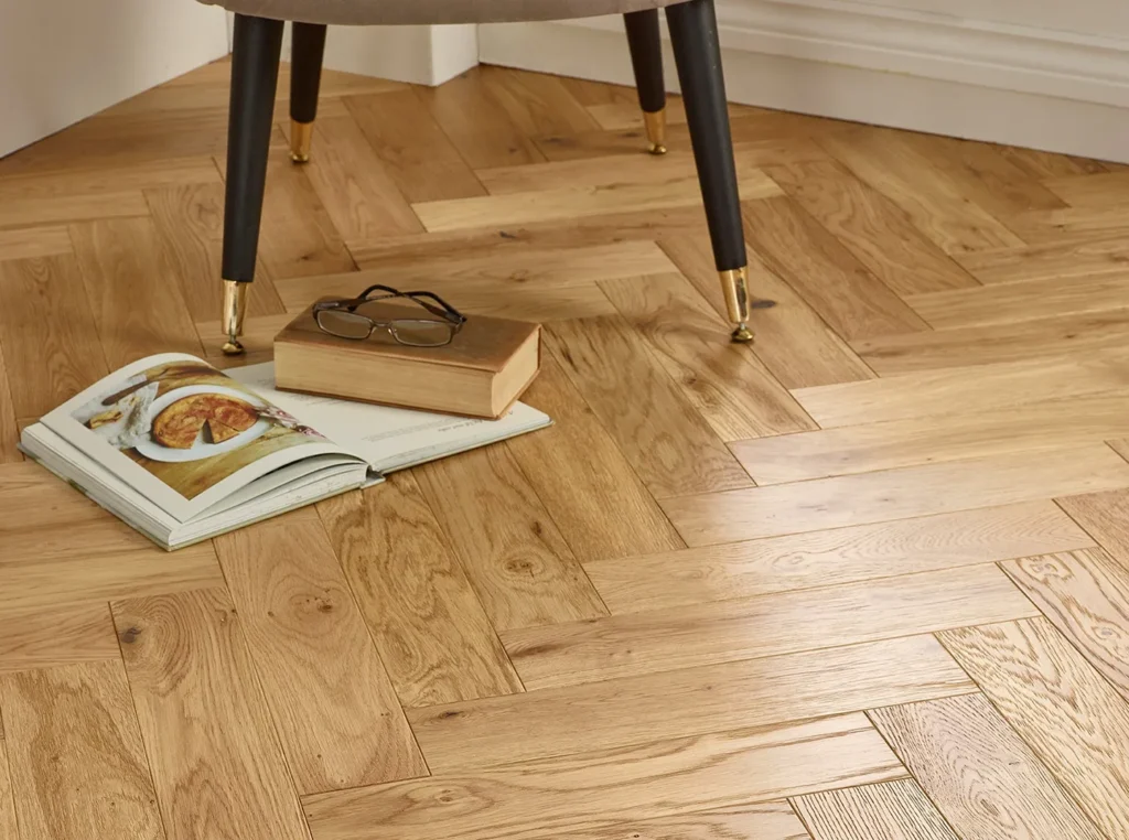 Wooden floor with book and eyeglasses.